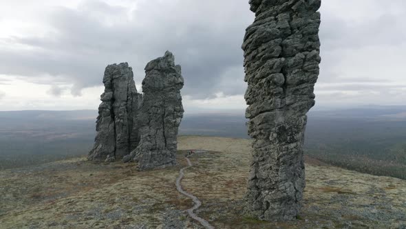 Aerial view of breathtaking stone pillars on the top of a hill