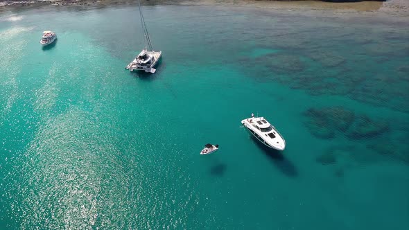 Anchored yacht with sunbathing people