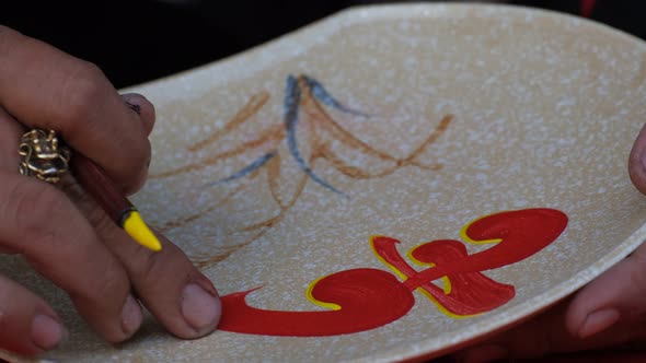 Vietnamese scholar writing calligraphy at lunar new year