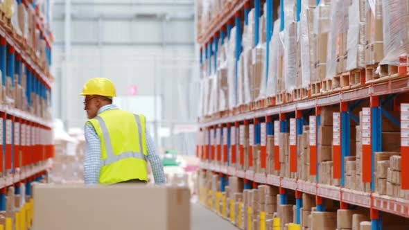 Warehouse worker looking at packages