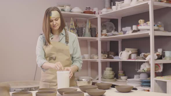 Craftswoman Working in Ceramic Workshop