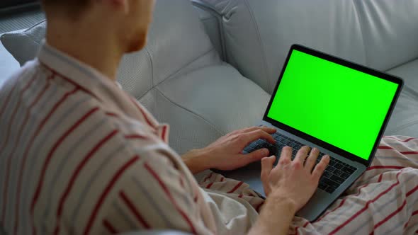 Freelancer Browsing Web Green Laptop Screen Closeup