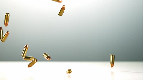 Bullets falling bouncing in ultra slow motion