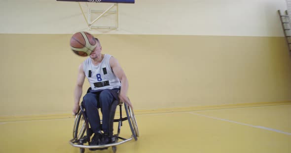 A Person with Disabilities Playing Basketball in the Modern Hall