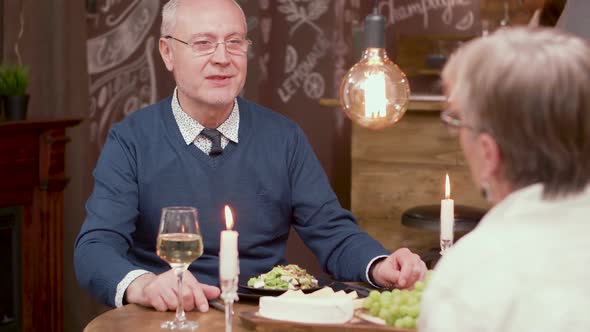 Old Man Making a Proposal To His Partner on a Romantic Dinner