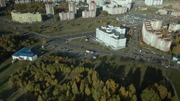 Flight over the autumn park. Trees with yellow autumn leaves are visible.