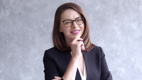 Portrait of Young Business Woman Isolated on Gray