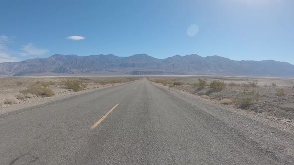 Driving through empty Death Valley, California, USA