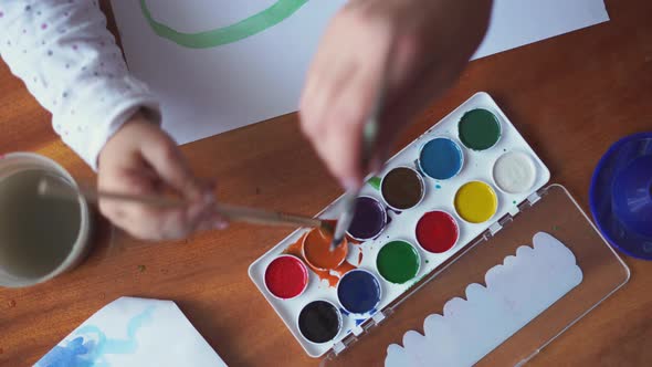 Close Up of Watercolor Paint Palette with Paint Brush. Creative Activity for Kids. Hobby Class