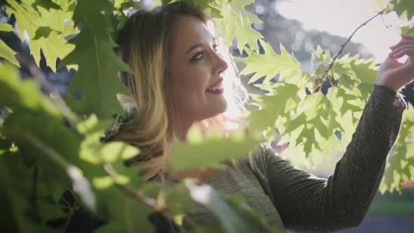 Delightful Young Woman Plus Size Enjoy Tree Leaves