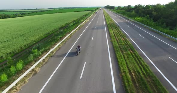 Driving the Road Through the Forest. Overhead Shot