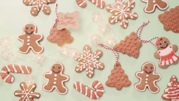 Time lapse. Traditional home made gingerbread cookies as food gifts on blue background with Christma