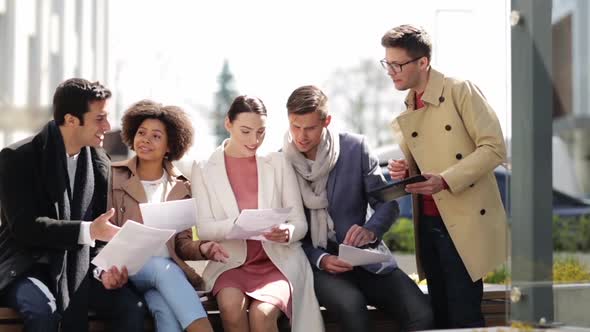 International Business Team with Papers Outdoors