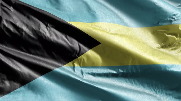 Bahamas textile flag waving on the wind. Slow motion. 20 seconds loop.