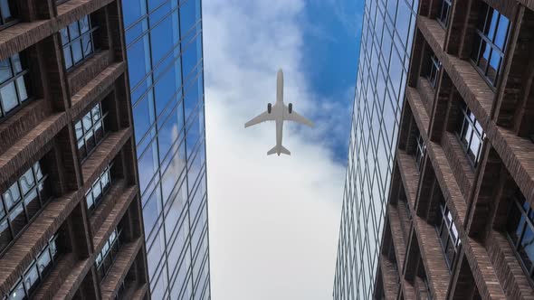 Plane Flying Over Corporate Office Buildings