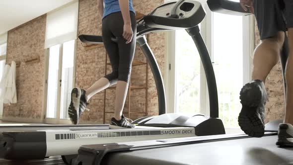 Man and woman exercising in gym