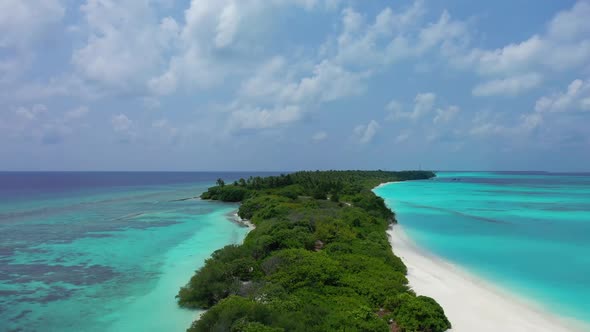 Aerial flying over nature of marine seashore beach adventure by clear sea with white sandy backgroun