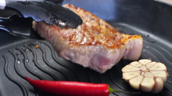 Grilled Raw Meat Steak in a Frying Pan