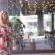 Cheerful Woman Walking Outside Restaurant - VideoHive Item for Sale