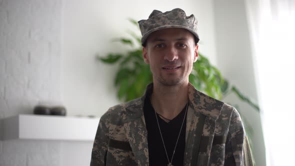 Portrait of a Man in Military Fatigues Face to Camera