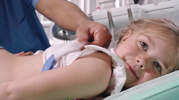 Little Girl Smiling during Ultrasound Scan