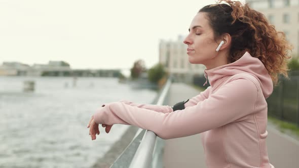 Portrait of Sportswoman Having Rest after a Run