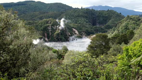 Waimangu Volcanic Rift Valley and Frying Pan Crater Lake hot spring with surrounding forests in Roto