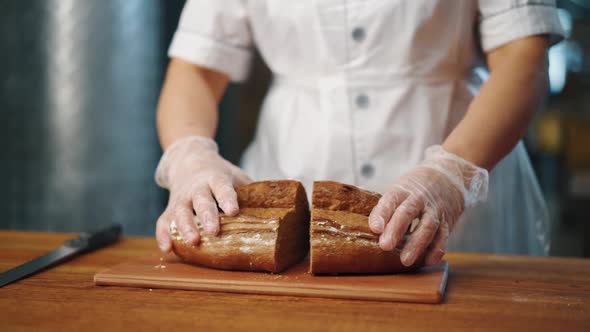 Female hands open sliced bread