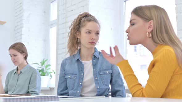 Upset Young Female Designers Having Argument in Office