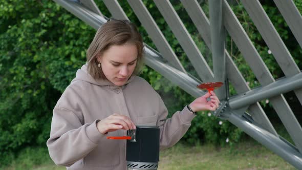 Young Girl Preparing a Picnic in Nature