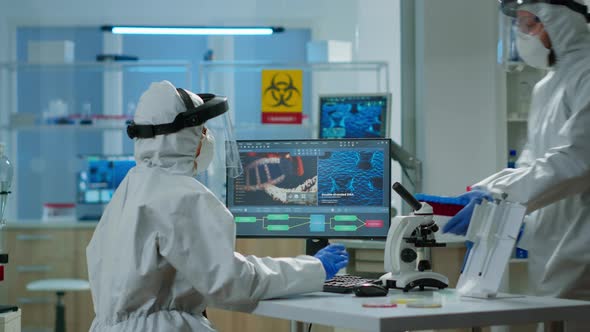 Chemist Woman in Ppe Suit Typing on Pc Checking Virus Development