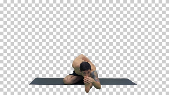 Young man practicing yoga in half hero stretch pose, Alpha Channel