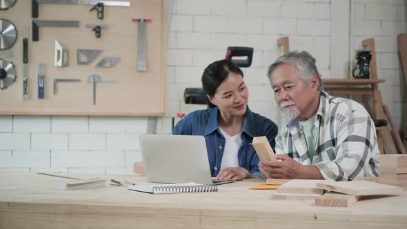 Senior man and woman working in garage