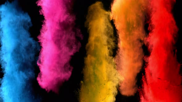 Super Slowmotion Shot of Color Powder Explosions Isolated on Black Background