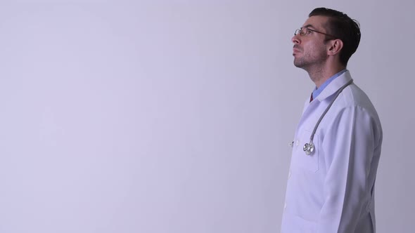 Profile View of Young Hispanic Man Doctor