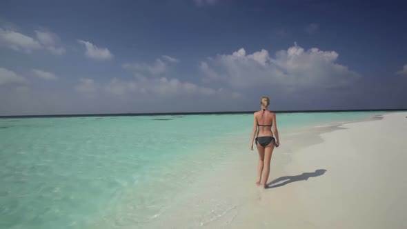 Beautiful Woman in Bikini Walking on Beach