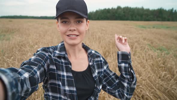 Countryside Female Farmer Walks Through a Field of Rye and Takes a Video of Himself the Video