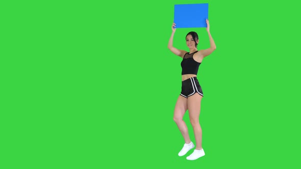 Ring Girl Walking Holding Empty Board Presenting New Round on a Green Screen, Chroma Key