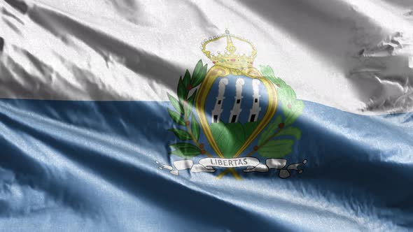 San Marino textile flag waving on the wind. Slow motion. 20 seconds loop.