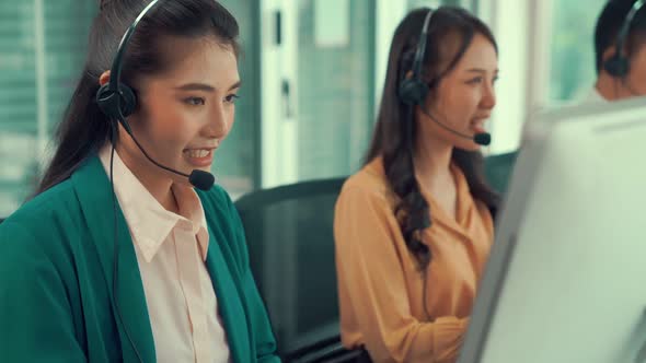Business People Wearing Headset Working Actively in Office