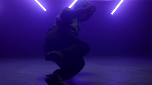 Unknown Guy Performing Hiphop Moves in Neon Lighting