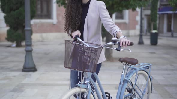 Moroccan Lady In Casual Wear With Bicycle Walking Outdoor On Daytime