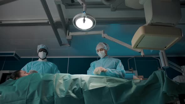 Darkskinned Surgeon Jokingly Beats a Bit on the Chest