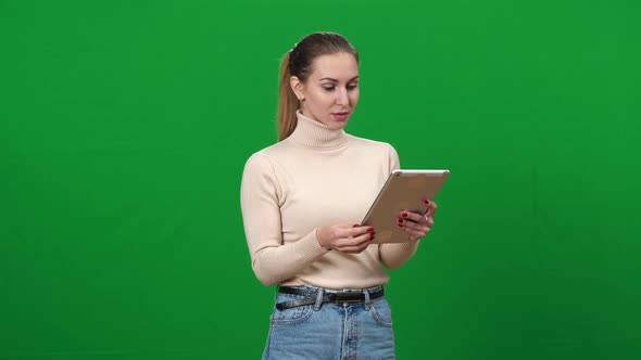 Brunette Slim Woman Using Tablet and Laughing