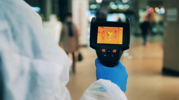 Thermal Camera Is Being Used By a Medical Worker To Scan People