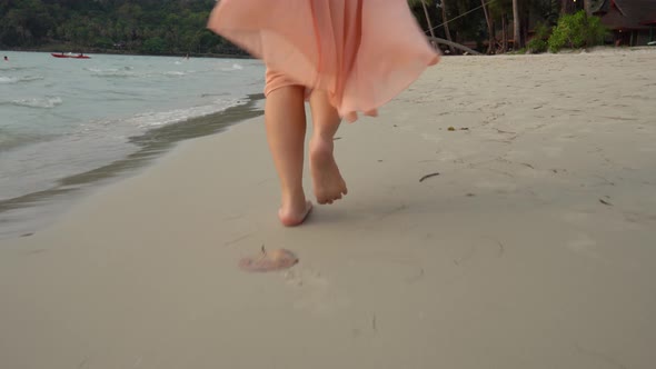 Close up leg of young woman walks barefoot on sand on the Beach.Travel  Summer vacations concepts