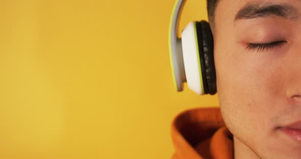 Young Man Listening To Music with Headphones