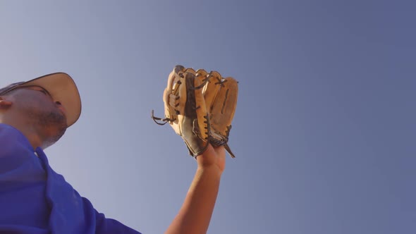 Baseball player catching a ball during a match