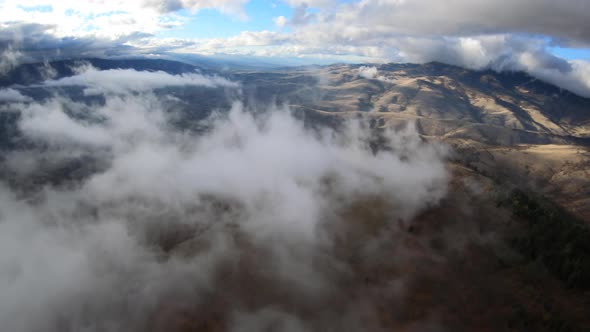 Siskiyou Pass Flying Above Thick Clouds Along Mountain Ridge Aerial View