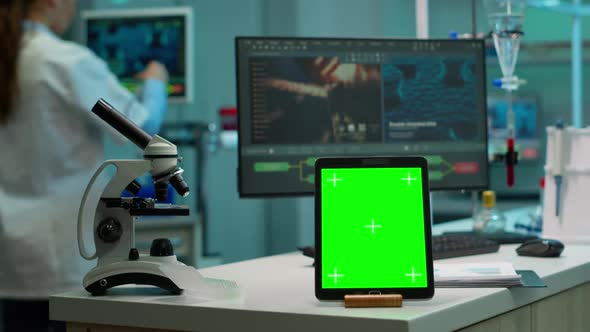 Tablet with Mockup Green Screen Placed in Front of Camera in Lab